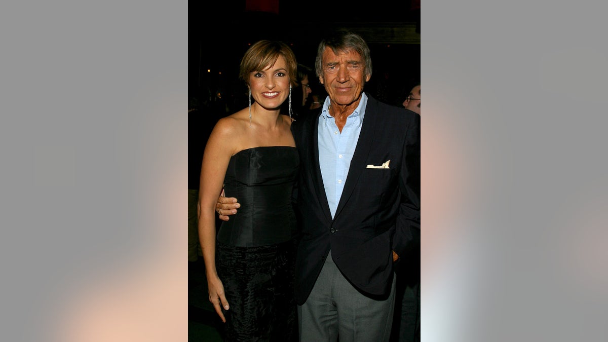 Mariska Hargitay being held by her father Mickey Hargitay on the red carpet.