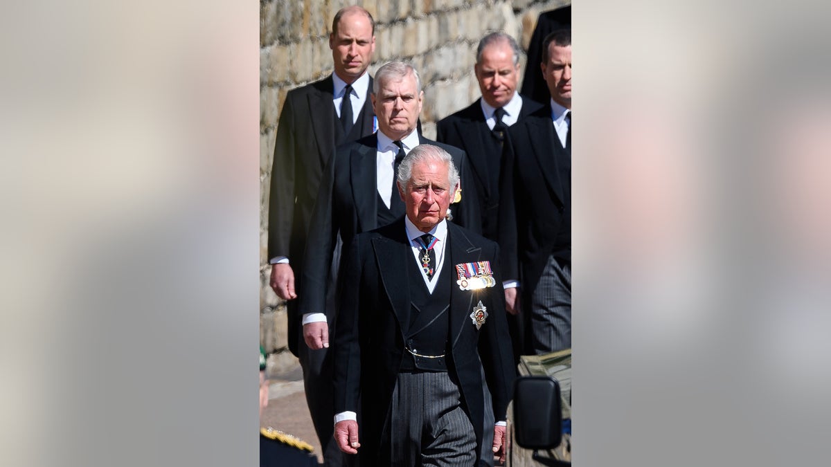 Prince William walking behind Prince Andrew and King Charles.