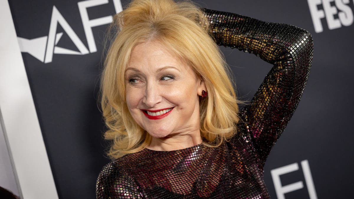 Patricia Clarkson playing with her hair