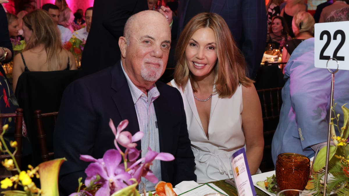 alexis joel and billy joel sitting at gala
