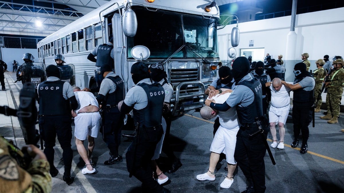 deported gang members getting off bus