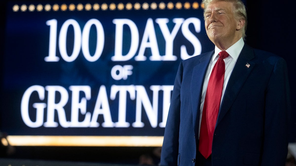 US President Donald Trump delivers a speech marking his 100th day in office at Macomb County Community College Sports Expo Center in Warren, Michigan, on April 29, 2025. Trump celebrated the first 100 days of what is already one of the most radical and far-reaching presidencies in US history, but polls show Americans becoming disenchanted with the economic and political tumult. (Photo by Jim WATSON / AFP)