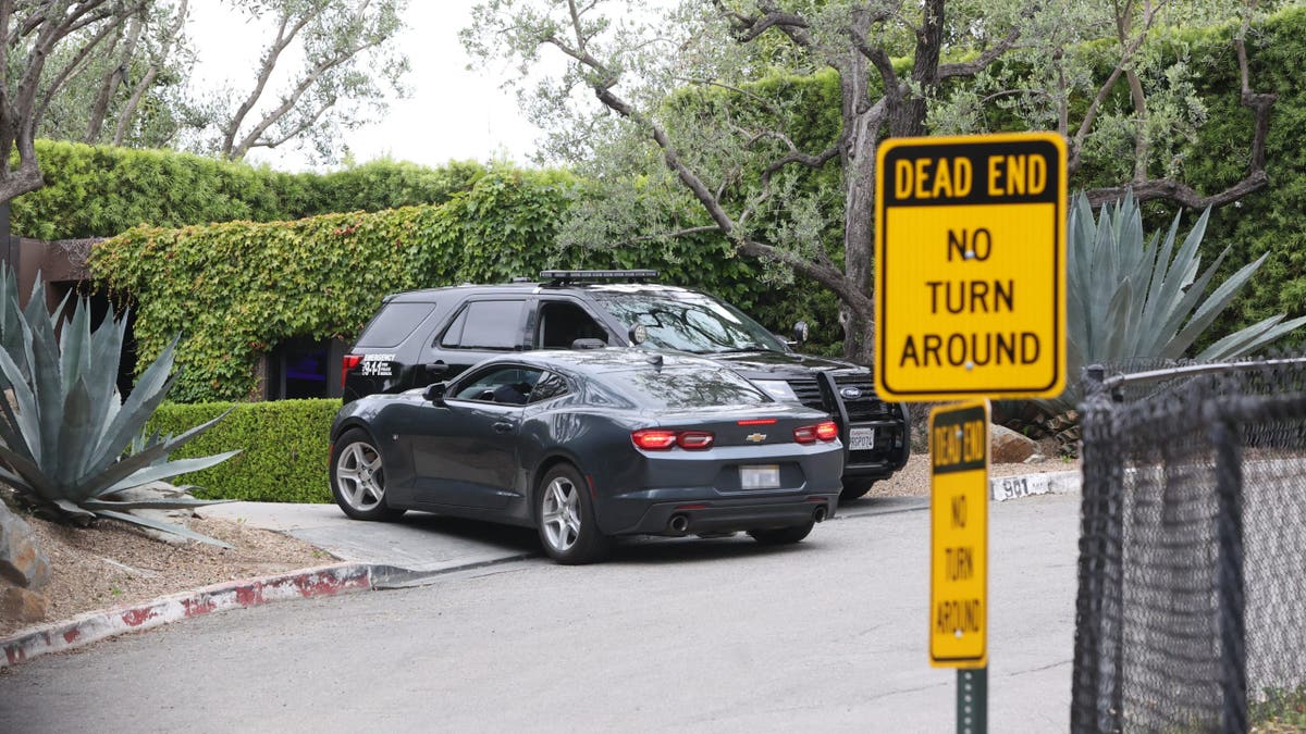 exterior of Jennifer Aniston's home with police car out front