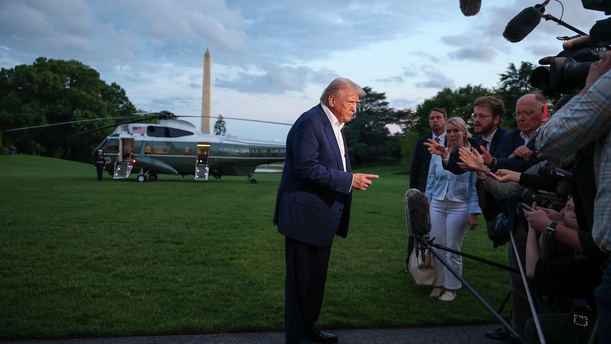 Donald Trump addresses reporters on the White House lawn