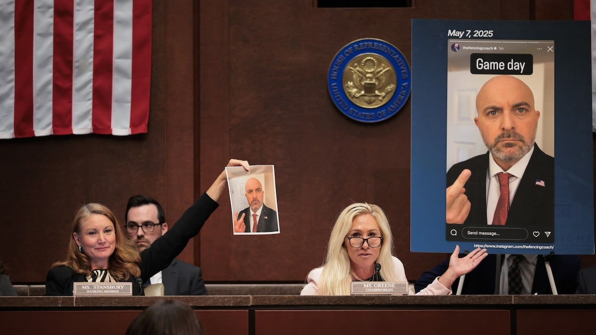 Rep. Melanie Stansbury, left, and Rep. Marjorie Taylor Greene speak about an alleged screenshot from the Instagram of USA Fencing Board Director Damien Lehfeldt during the hearing on "Unfair Play: Keeping Men Out of Women’s Sports" held by the Department of Government Efficiency Subcommittee at the U.S. Capitol on May 7, 2025 in Washington, D.C.