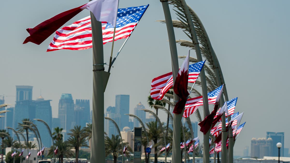 U.S. and Qatar flags flutter on the Doha corniche ahead of the arrival of U.S. President Donald Trump in Doha, Qatar, on May 13, 2025