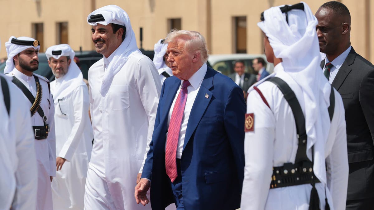 President Donald J. Trump speaks with Emir of Qatar Tamim bin Hamad al Thani as he departs the Al Udeid Air Base for Abu Dhabi on May 15, 2025, in Doha, Qatar. (Win McNamee/Getty Images)