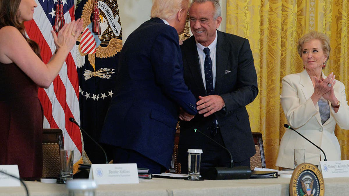 (L-R) Agriculture Secretary Brooke Rollins, President Donald Trump, Health and Human Services Secretary Robert F. Kennedy Jr. and Education Secretary Linda McMahon attend an event for a new Make America Healthy Again Commission report in the East Room of the White House on May 22, 2025, in Washington, DC. (Photo by Chip Somodevilla/Getty Images)