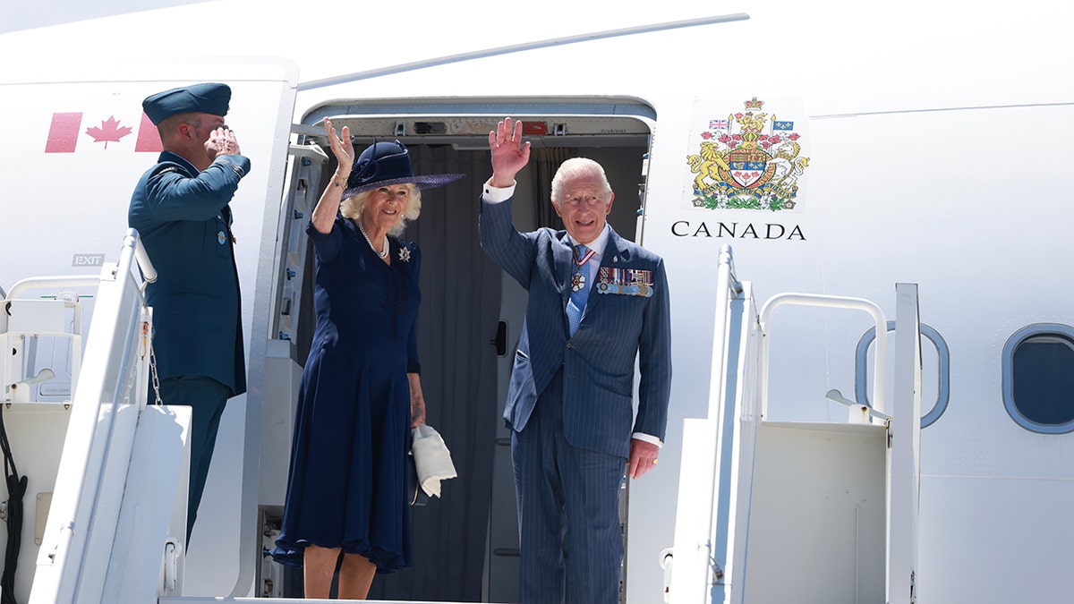 King Charles III and Queen Camilla wave