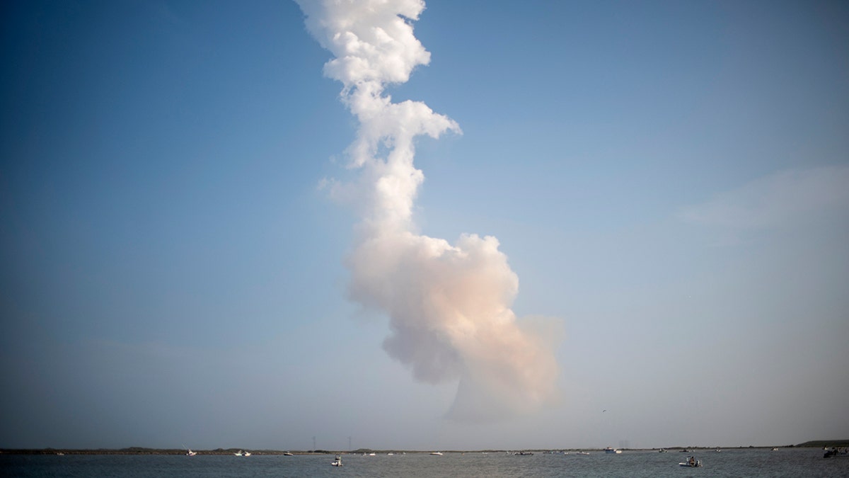 A plume of exhaust from the rocket boosters