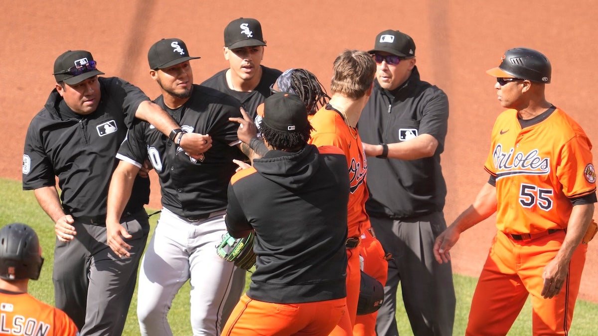 Lenyn Sosa (50) of the Chicago White Sox pushes Coby Mayo (16) of the Baltimore Orioles after getting pushed in a rundown in the fourth inning that led to the benches clearing at Oriole Park at Camden Yards May 31, 2025, in Baltimore.  