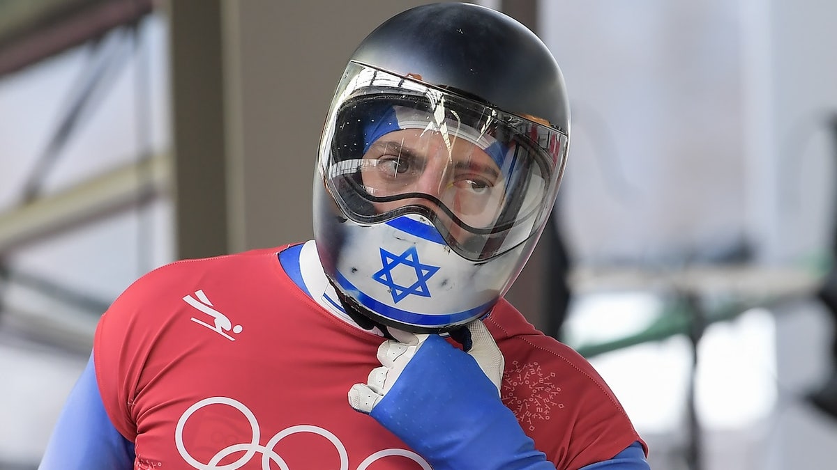 Israel's Adam Edelman takes off his helmet after a training session for the men's skeleton during the Pyeongchang 2018 Winter Olympic Games, at the Olympic Sliding Centre on Feb. 14, 2018 in Pyeongchang, South Korea.