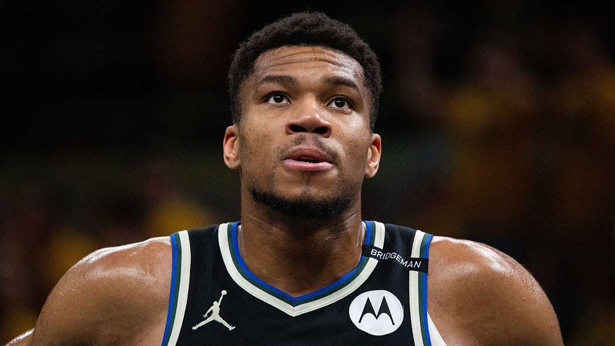 Giannis Antetokounmpo looks on