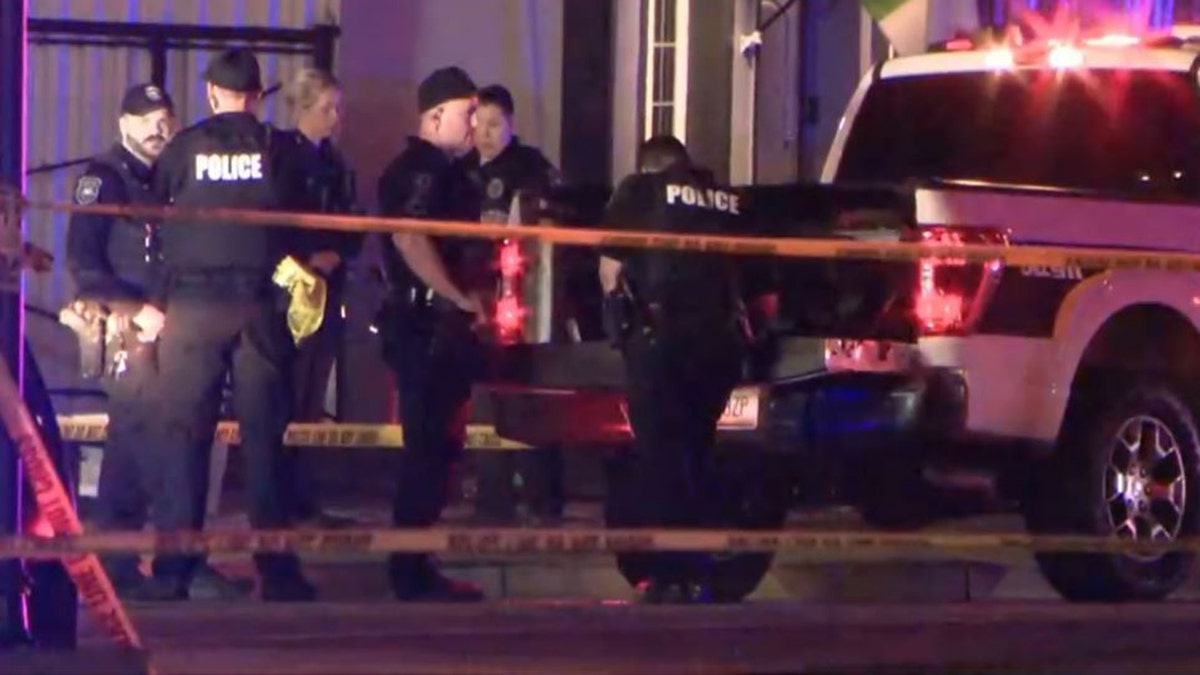 police officers and constabulary vehicles astatine nan shooting scene