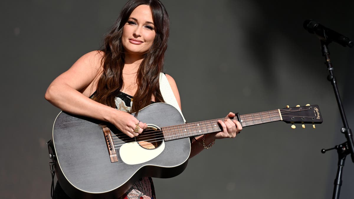 Kasey Musgraves with a guitar