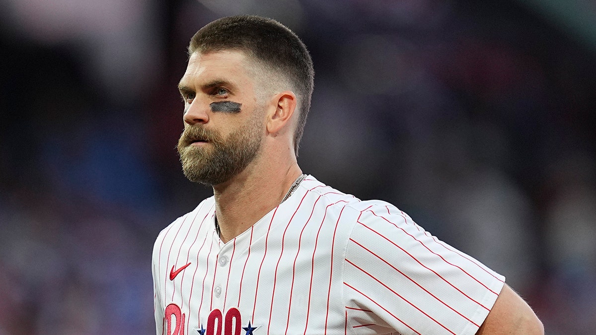 Bryce Harper looking on