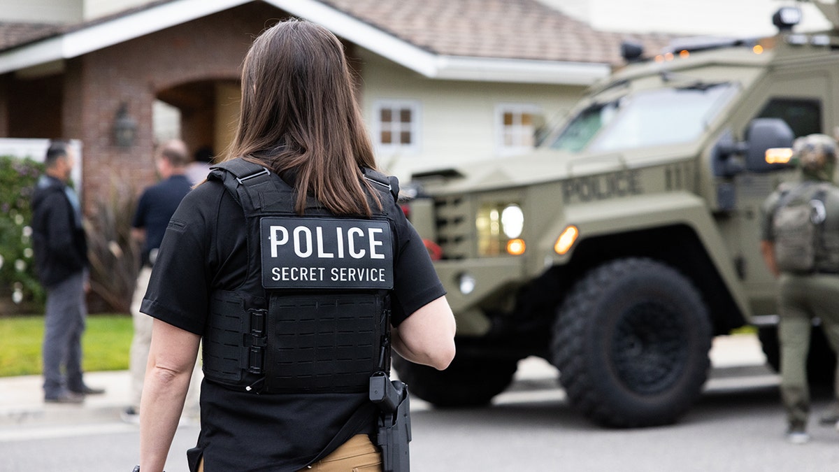 ICE agents at the home of an Irvine, Calif., doxing suspect