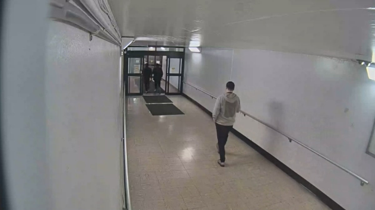 An ICE agent can be seen following Fores-Ruiz and his attorney out the Milwaukee County Courthouse