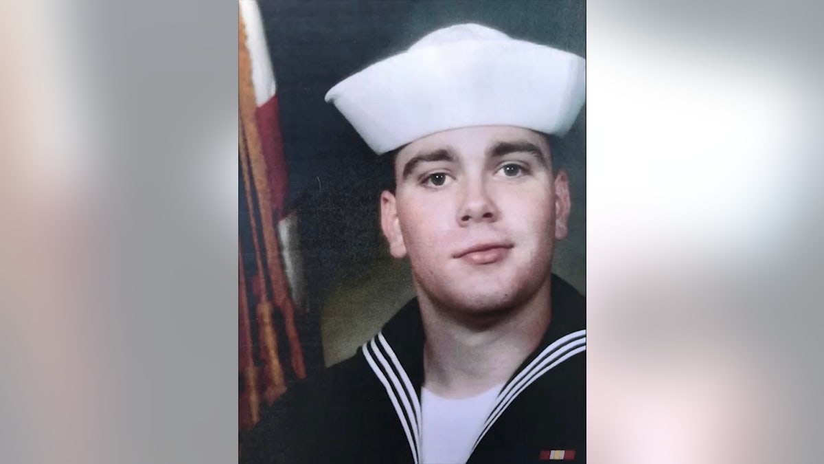 Micah Holsonbake successful his Navy uniform.