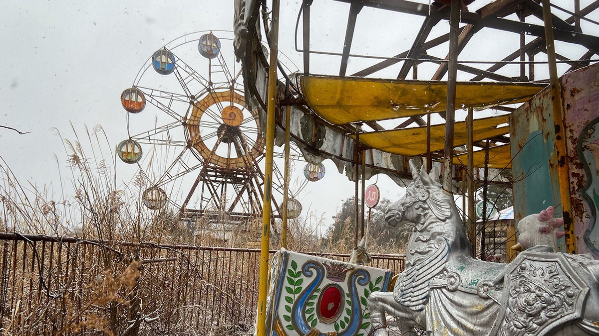 The abandoned Kejonuma Leisure Land, Japan. Photo released May 16 2025. These images capture the haunting remains of two abandoned Japanese theme parks - including a derelict colonial American town with hotels, churches and restaurants.Lukka Bradburn, 28, gained access to the sites while exploring the Fukushima Red Zone - ghost towns left behind after the nuclear disaster in 2011. Pictures of the Western Village theme park near Nikkō, Tochigi, show a vast, empty landscape reminiscent of 1800s America. Opened in 1973, it was inspired by classic American and Italian Western movies but closed in 2007 because of competition from Tokyo Disneyland.
