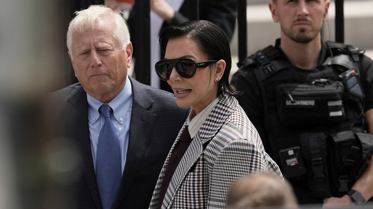 Kardashian's mom, with lawyer Michael Rhodes, accompanied her daughter as they entered the courthouse.