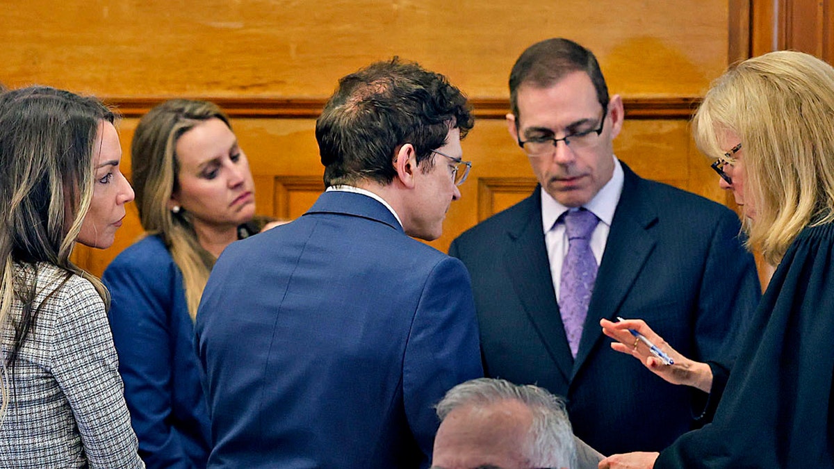 Karen Read's lawyers confer with the judge during her retrial