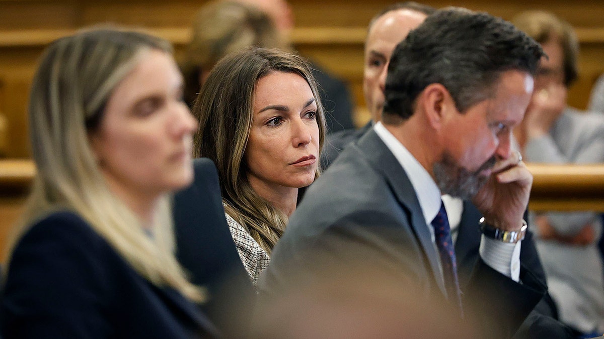 Karen Read in sits with her lawyers in court during her retrial for the murder of John O'Keefe
