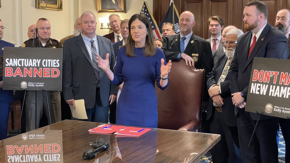 Republican Gov. Kelly Ayotte of New Hampshire highlights her state's status as the safest in the nation as she signs into law two bills that ban sanctuary cities, at the Statehouse in Concord, N.H. on May 22, 2025.