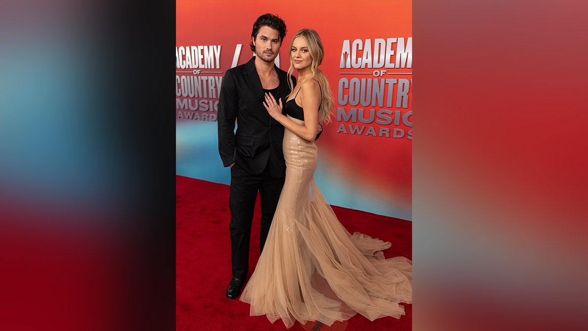 Kelsea Ballerini and Chase Stokes on the ACM Awards red carpet.