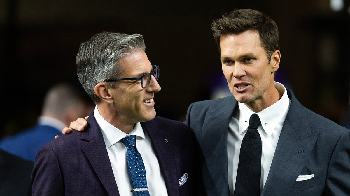 Kevin Burkhardt and Tom Brady on field