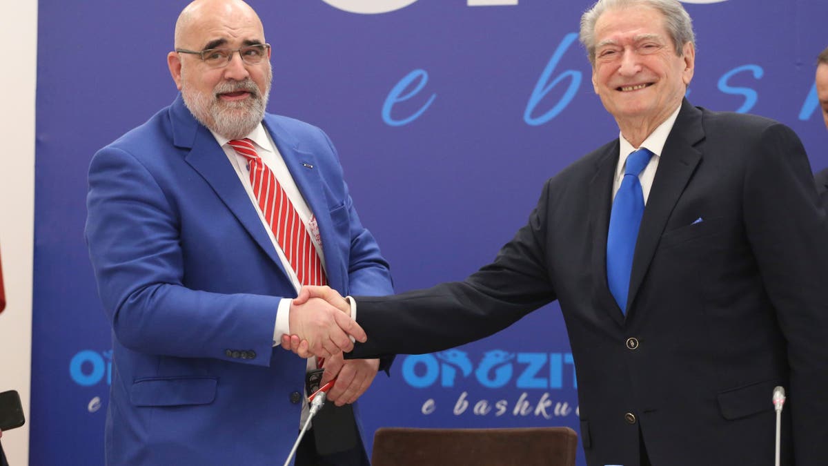 Chris LaCivita, who served as co-campaign manager of Donald Trump's successful 2024 presidential campaign, shakes hands with Sali Berisha, leader of Albania's main opposition center-right Democratic Party that he is consulting for the upcoming May 11 parliamentary election, in Tirana, Albania, Feb. 10, 2025.