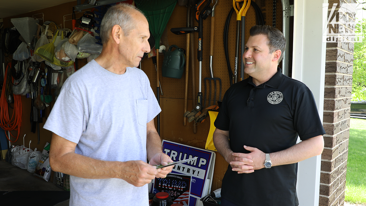 Mackenzie greets a supporter in his garage in Bethlehem, Pennsylvania.