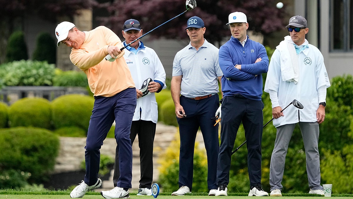 Peyton Manning tees off