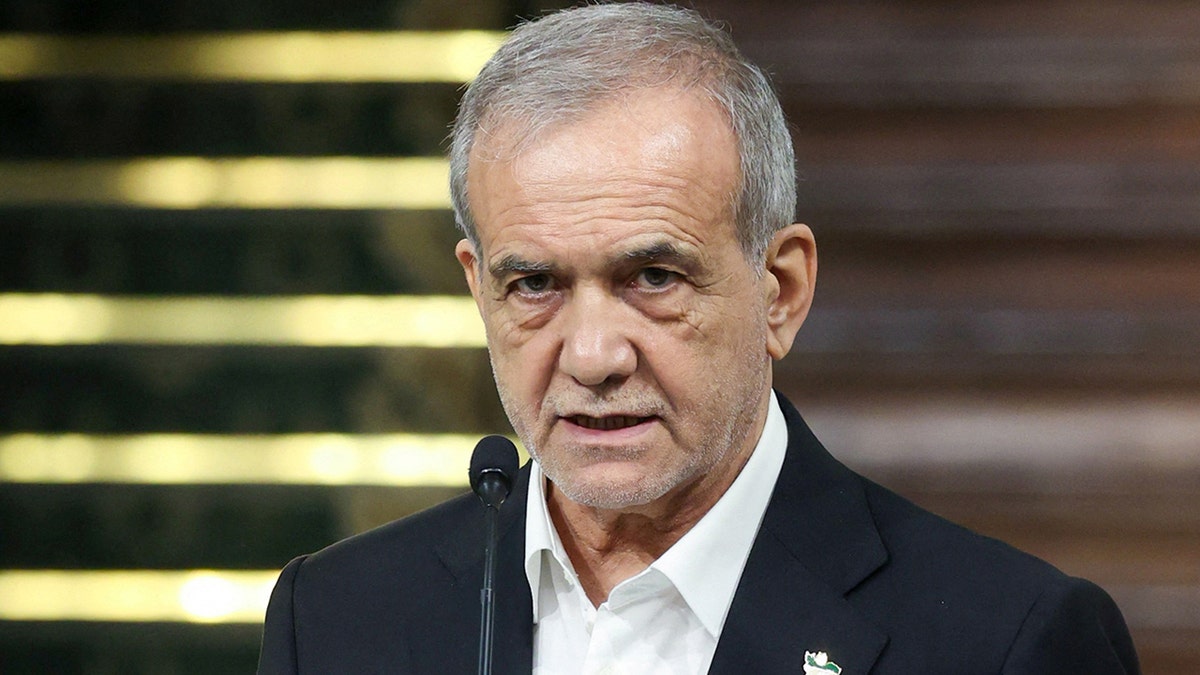 Iranian President Masoud Pezeshkian with a microphone