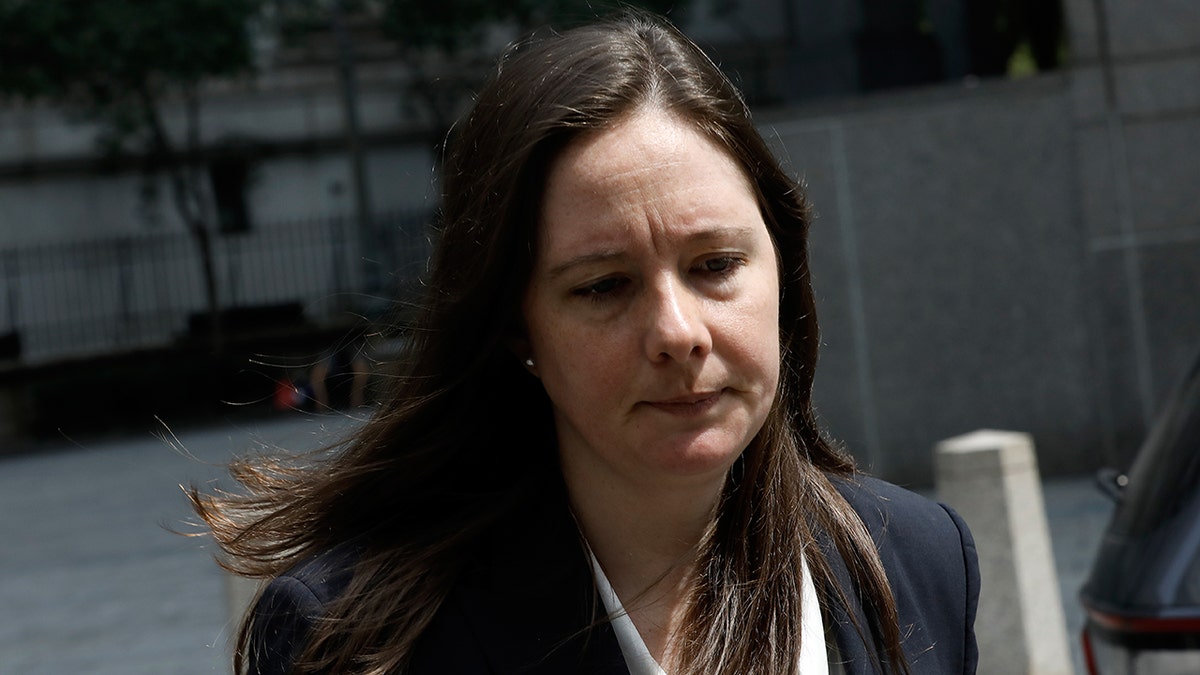 Attorney Maurene Comey wears grey suit.