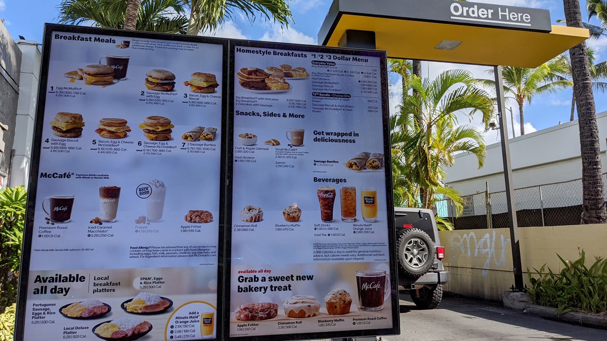 A McDonald's drive-thru breakfast menu is shown.