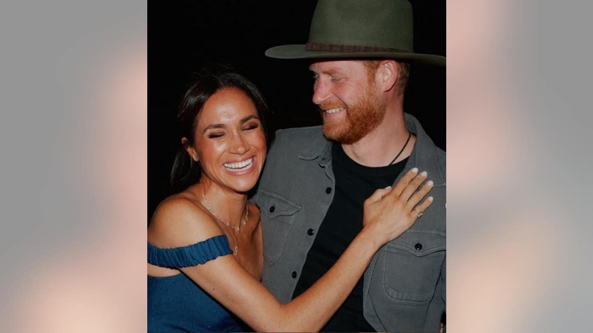 Meghan and harry laughing