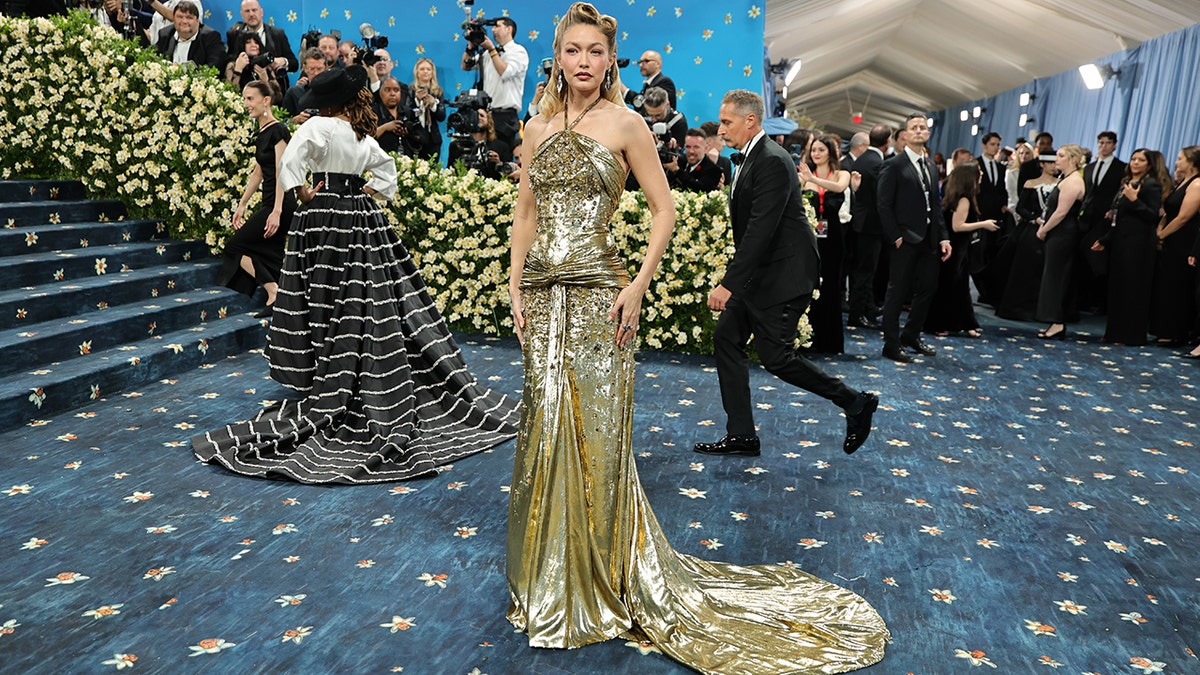Gigi Hadid at the 2025 Met Gala in a gold dress