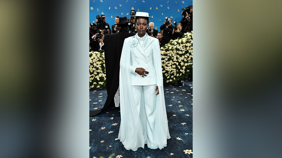 Lupita Nyong'o at the Met Gala in a blue suit