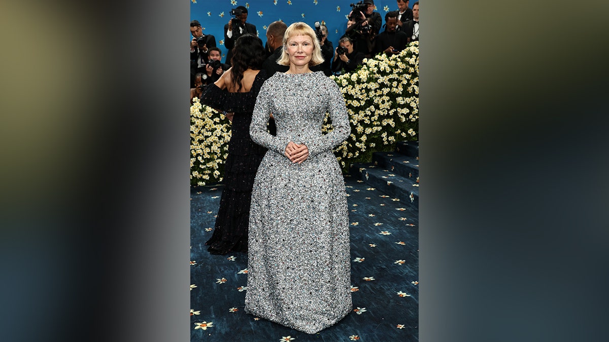Pamela Anderson in a sparkly gown at the Met Gala red carpet.