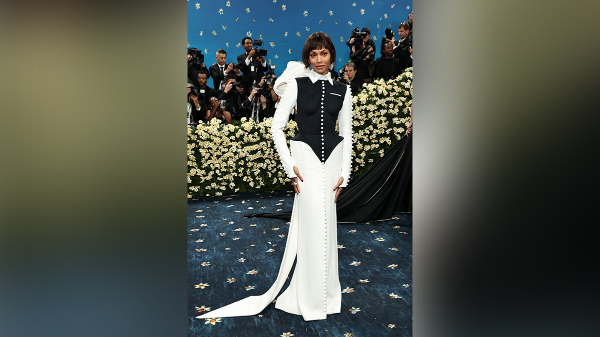 Zoe Saldana at the Met Gala 2025 in a black and white gown