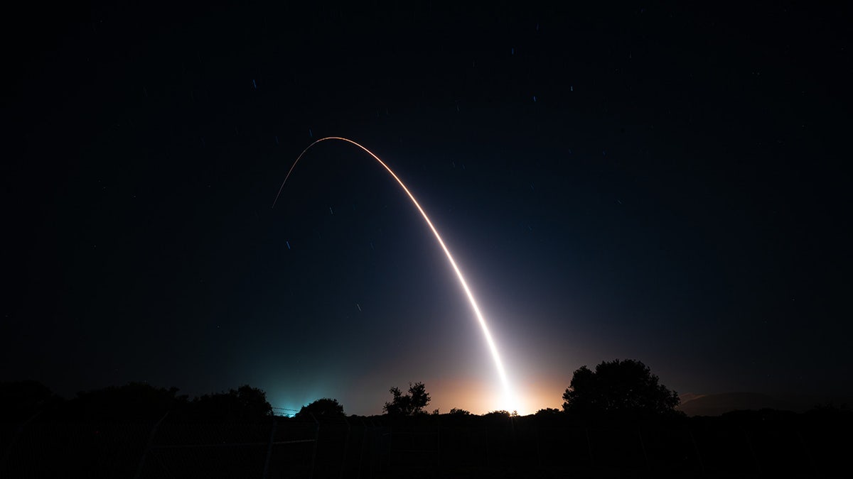 Intercontinental ballistic missile arc and night sky