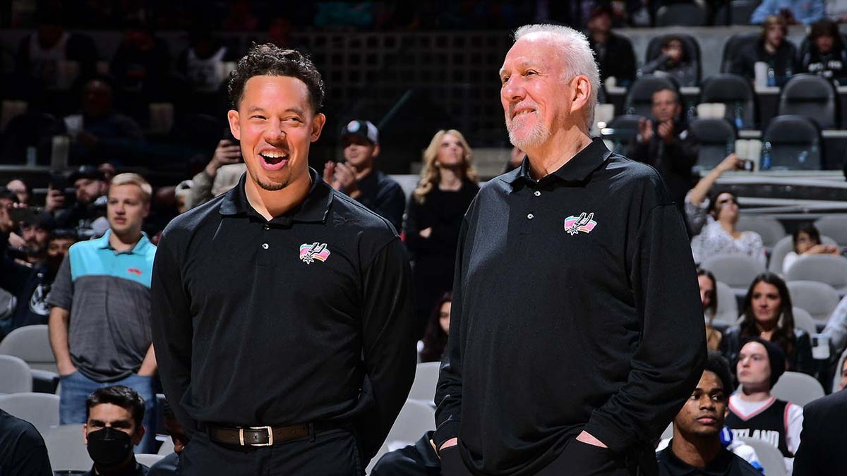 Gregg Popovich and Mitch Johnson