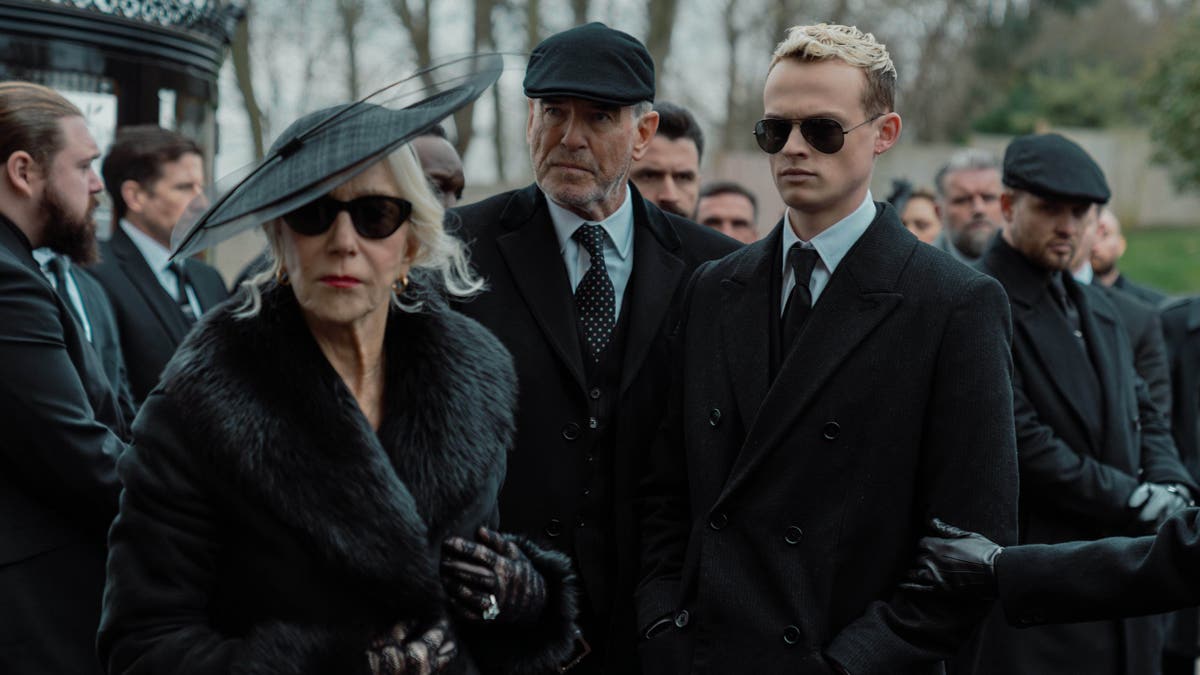 Helen Mirren as Maeve Harrigan, Pierce Brosnan as Conrad Harrigan, and Anson Boon as Eddie Harrigan in a scene from Mobland