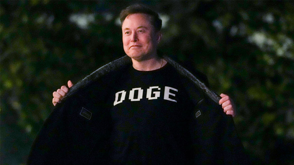 Musk in a DOGE shirt