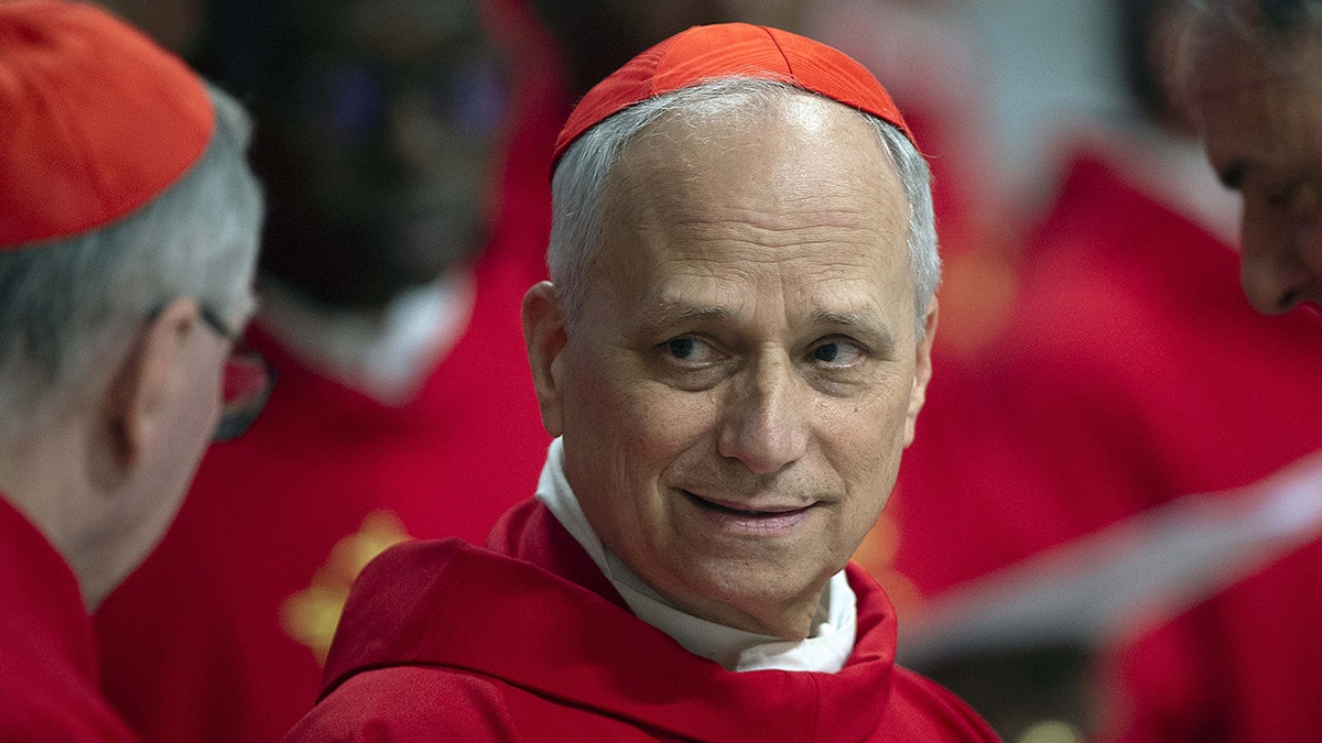 FILE – Cardinal Robert Francis Prevost (prefect of the Dicastery for Bishops) attends a mass on the third of nine days of mourning for late Pope Francis, in St. Peter's Basilica at the Vatican.