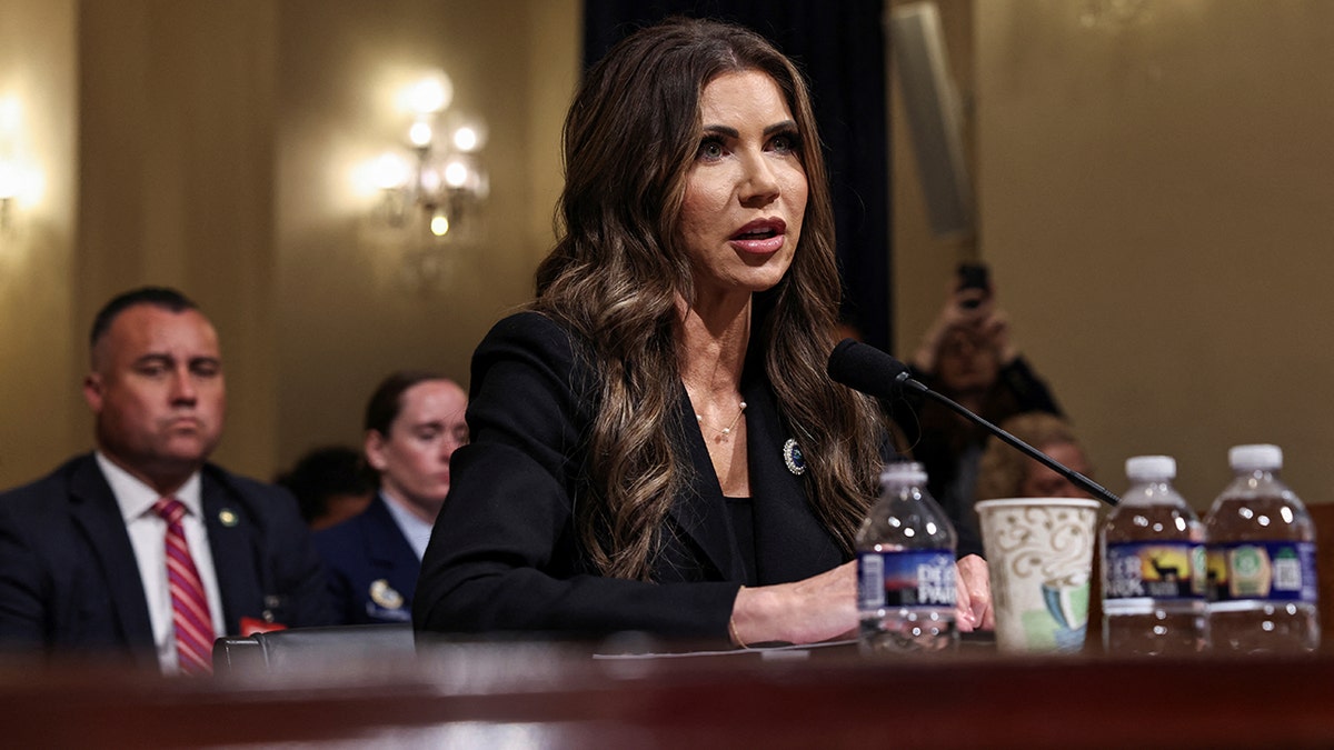 Noem wearing black testifies before House
