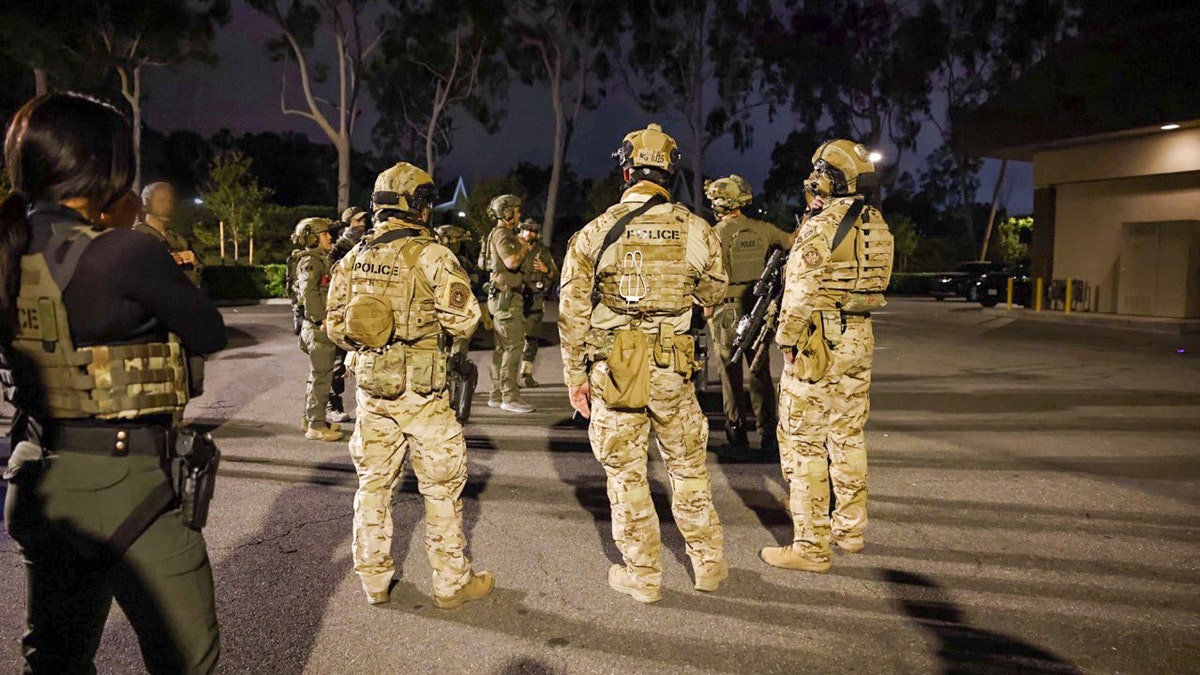 ICE agents on the street in Irvine, Calif.