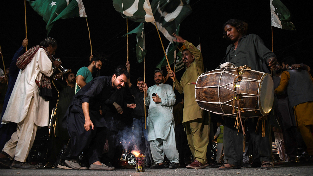 People celebrate after the ceasefire announcement