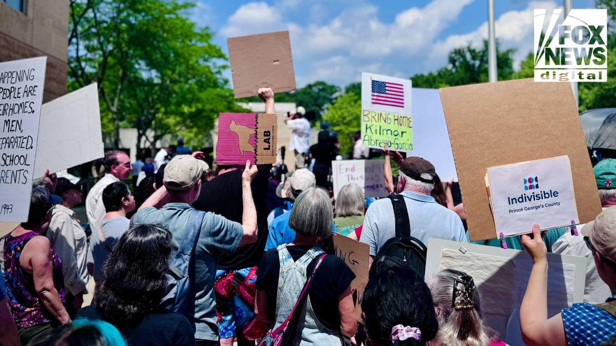 A crowd of demonstrators holds protest signs outside the U.S. District Court in Greenbelt, Maryland, demanding the return of Kilmar Abrego Garcia. Visible signs read